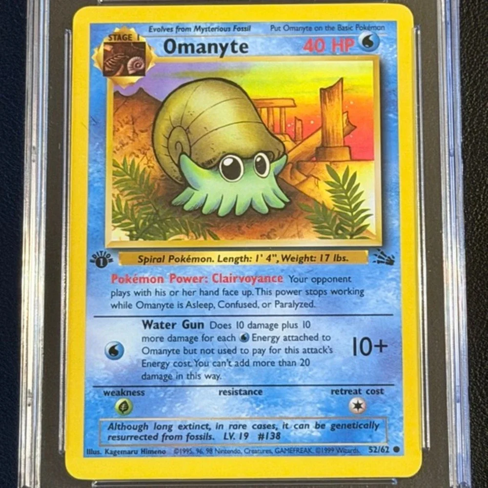 Pokemon Omanyte 1st Edition Fossil 52/62 CGC 9 Mint Blue Label TCG 1999 WotC Vtg